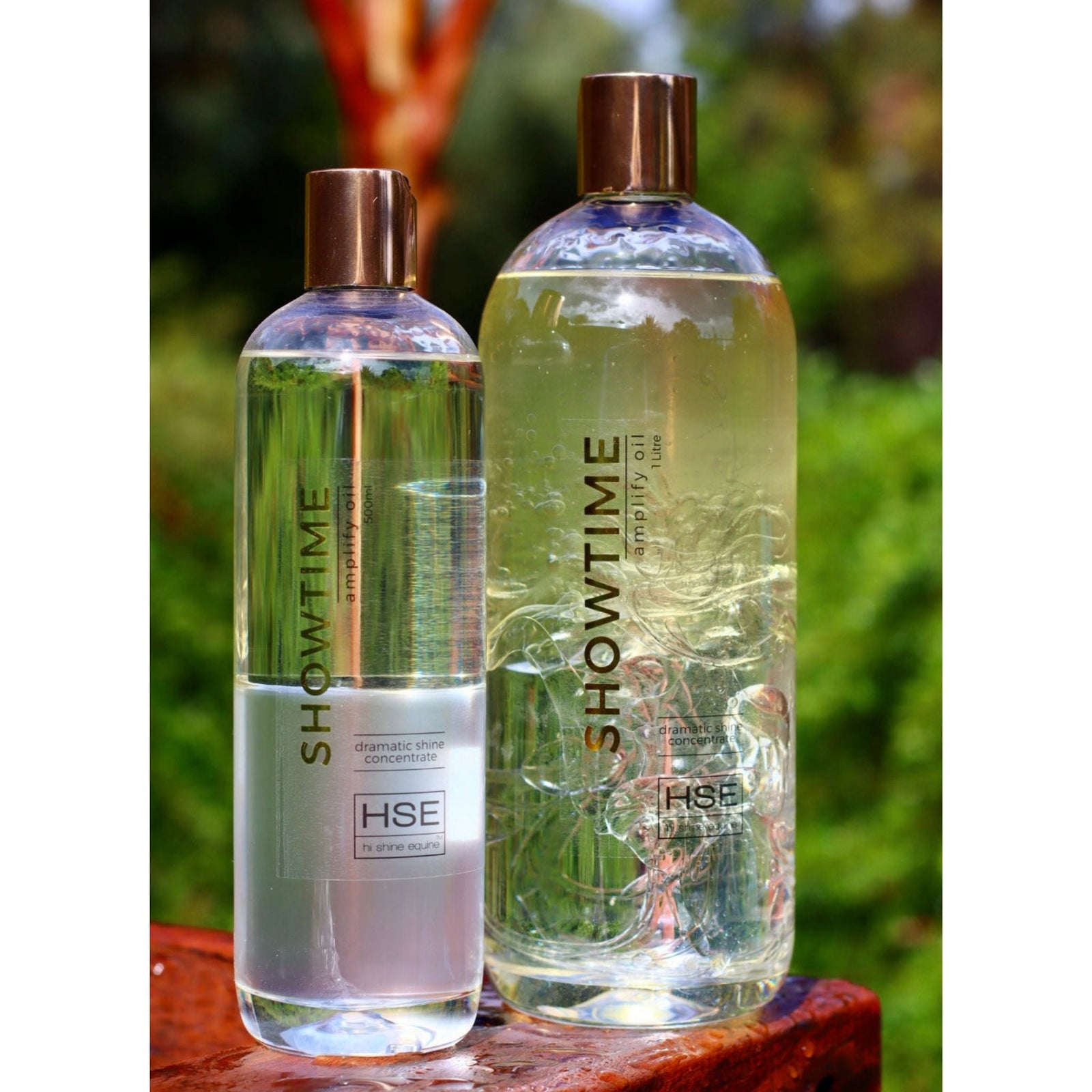 Clear bottle with rose gold lid.