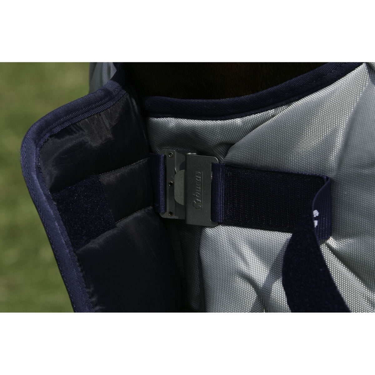 Close up of Bucas "clickgo" front fastener, closed, with navy strap.