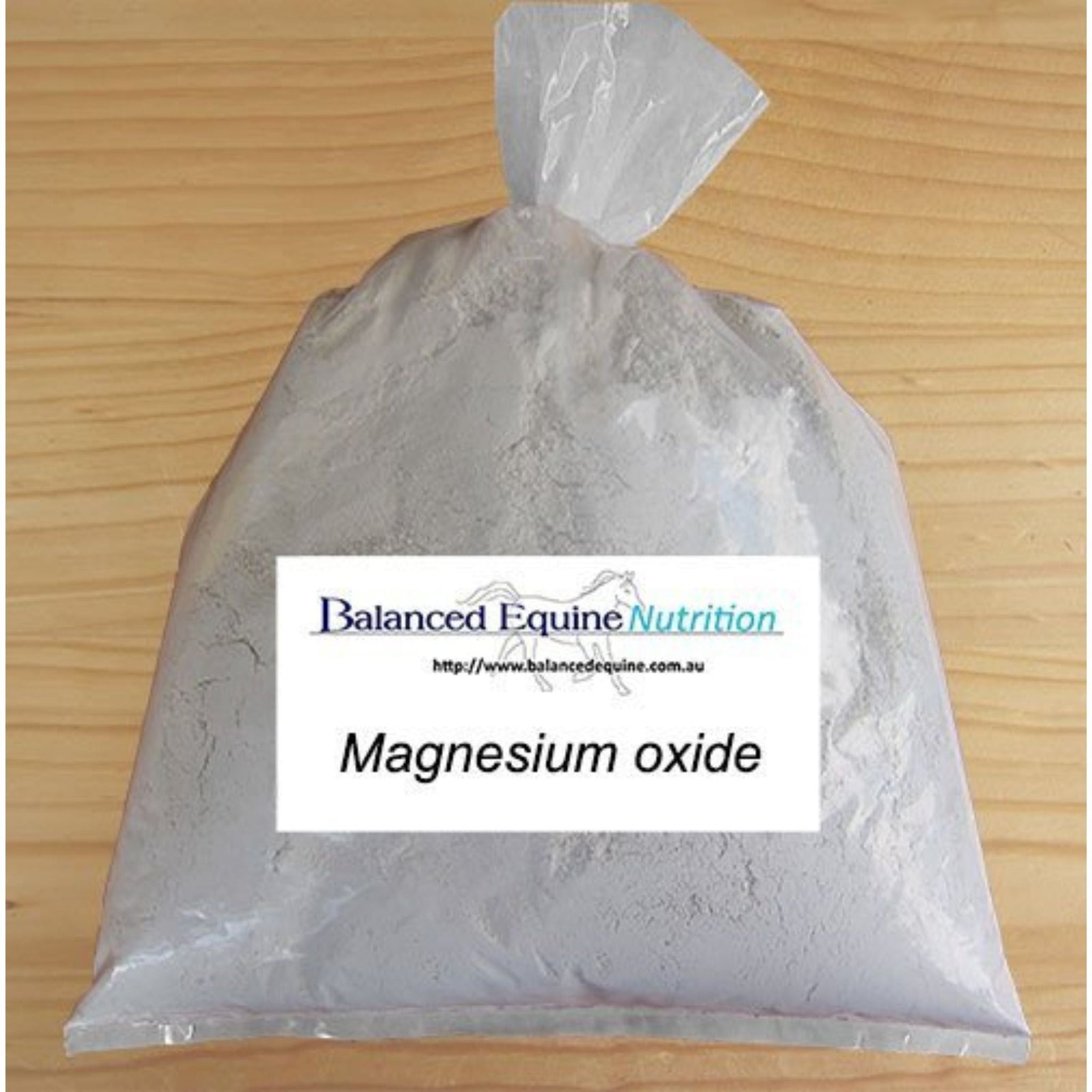 Transparent packet of powdered product with rectangular label on front.