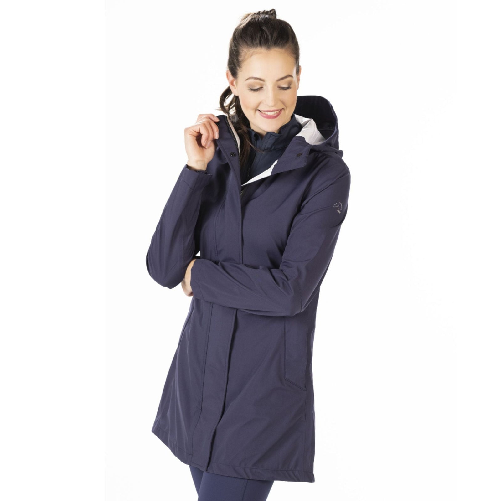 Frontview of girl wearing Weatherproof raincoat.