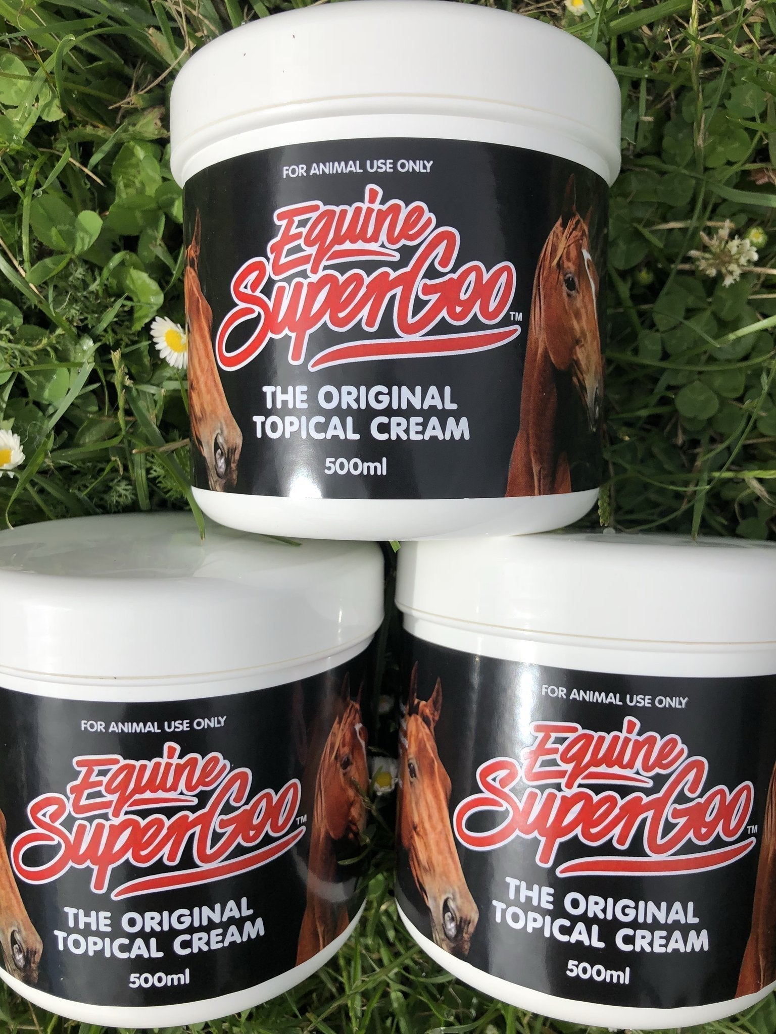 Cylindrical white tub of product with screw lid and black label.